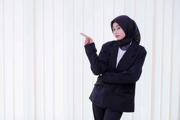 Seriously business woman pointing something