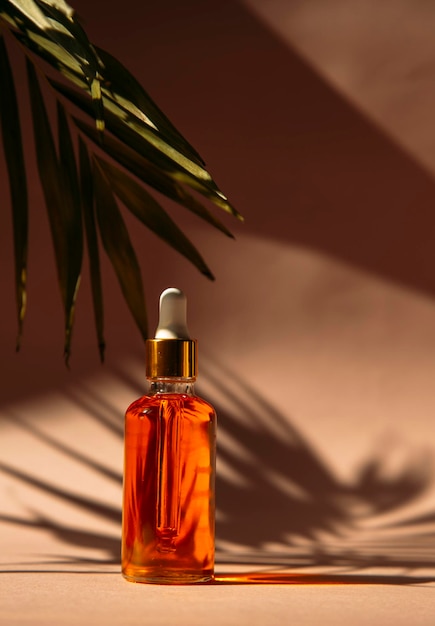 serum in a glass bottle with a pipette oil for the care of womens skin
