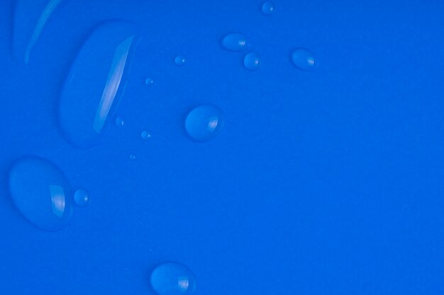 Serum smear smudge with collagen and peptides on blue surface