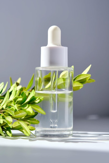 Serum with a dropper with spring flowers