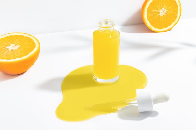 Serum with vitamin C and orange fruits