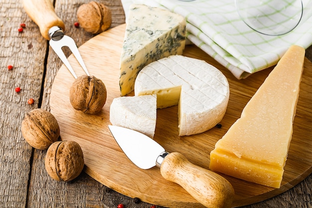 Served cheese and wine on old wooden table