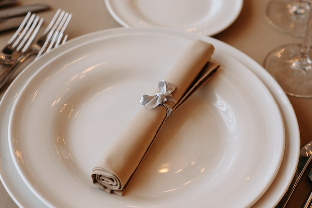 Served dinner table in a restaurant Restaurant interior table setting for a dinner