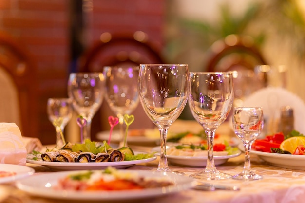 Photo served festive table with snacks glasses glasses cutlery and napkins for a banquet