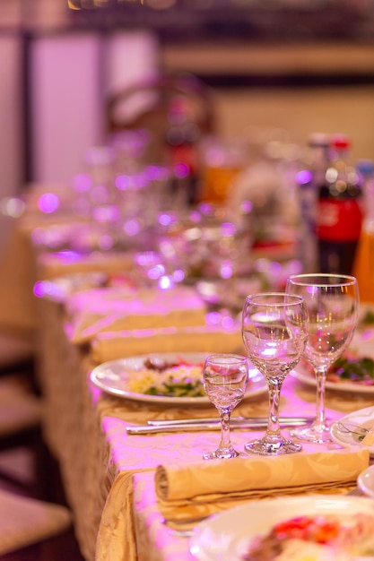 Photo served festive table with snacks glasses glasses cutlery and napkins for a banquet