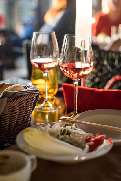 A served table in restaurant with two glasses of vine