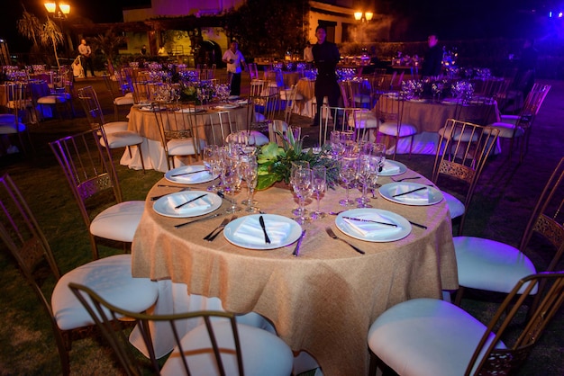 Served tables at the banquet in purple tones