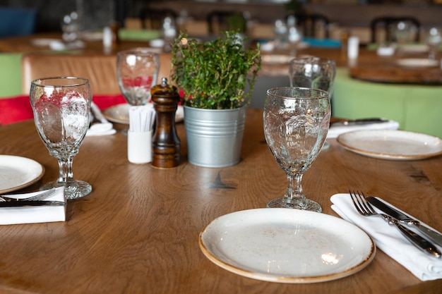 Served tables at beautiful interior of cafe or restaurant