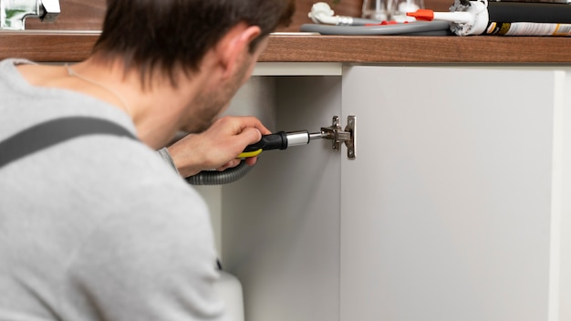 Photo service maintenance worker repairing