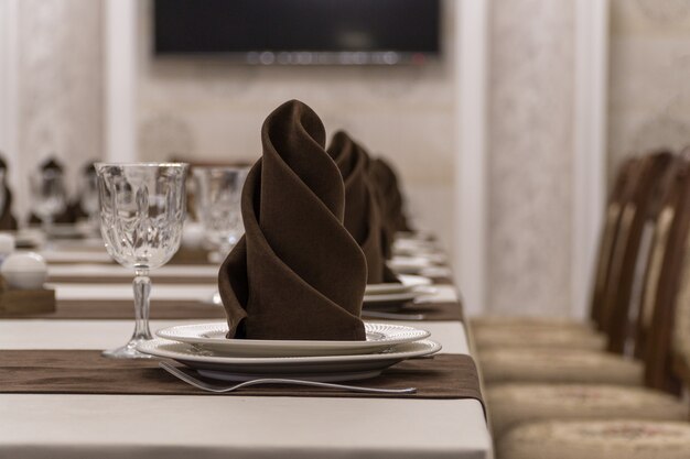 Serving banquet table in a luxurious restaurant in brown and white style