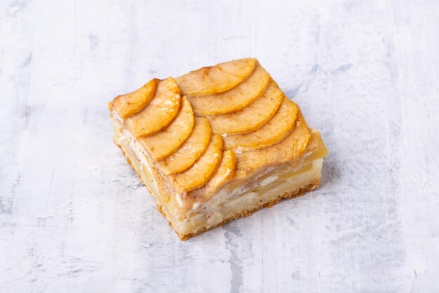 Serving of delicious fruit vanilla cake on a white plate