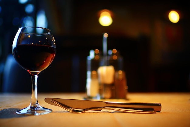 Serving a glass of red wine in a restaurant