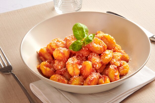 Premium Photo | Serving of gnocchi pasta with pomodoro sauce