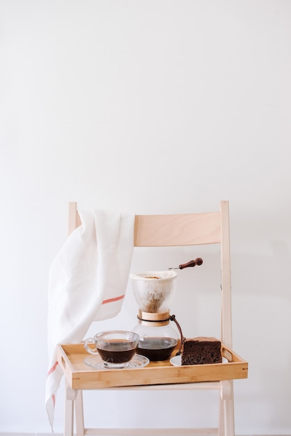 Serving hot coffee in the living room of his home in the morning