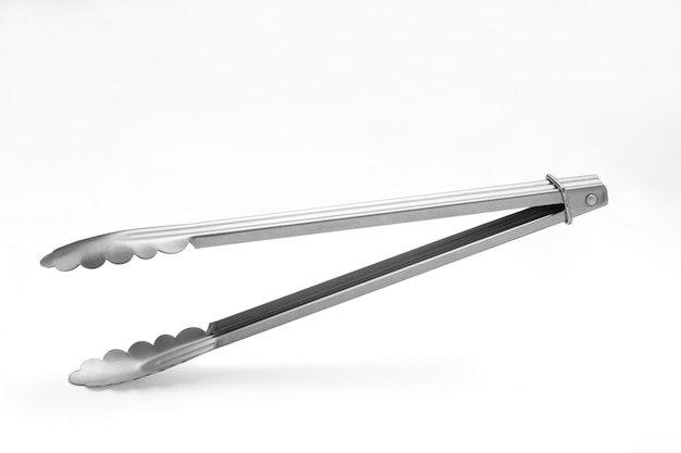 Serving kitchen tongs on white