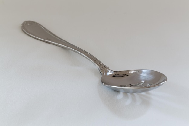 Serving spoon stainless steel on wood