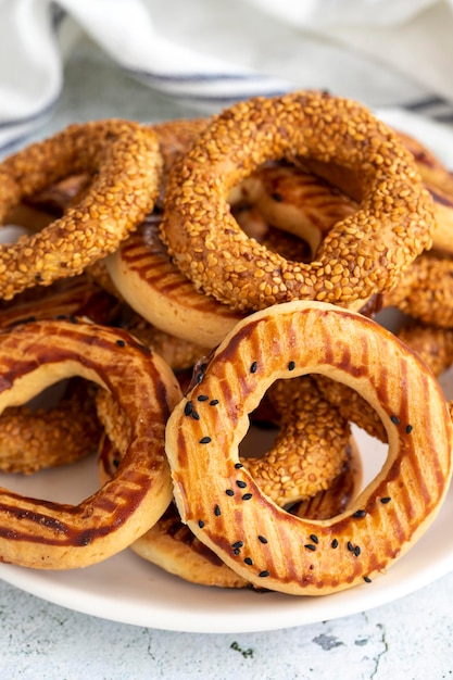 Sesame bagel on a gray background Traditional Turkish cuisine delicacies local name kandil simidi