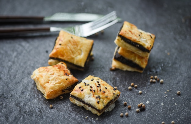 Sesame puff served on dark plate in traditional oriental