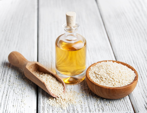 Sesame seeds and bottle with oil