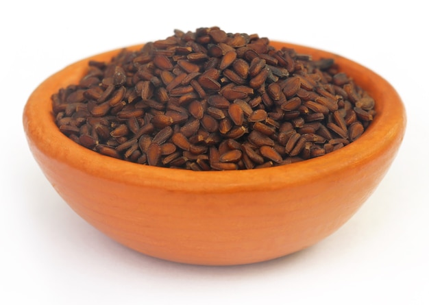 Sesame seeds on brown pottery