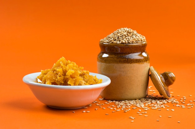 Sesame Seeds in clay pot with Jaggery in bowl