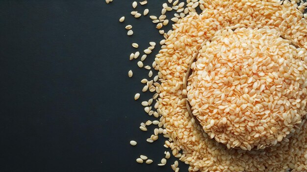 Sesame seeds on dark background