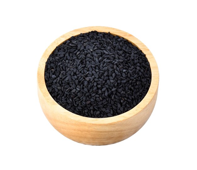 Sesame seeds isolated in a wooden bowl