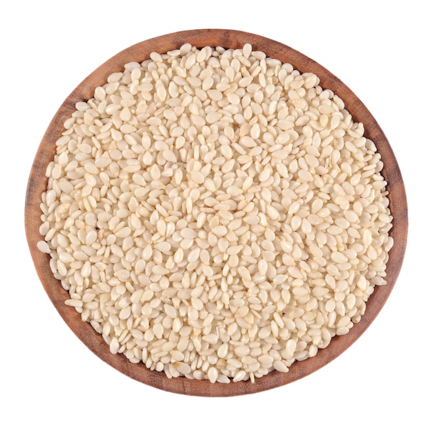 Sesame seeds in a wooden bowl on a white background