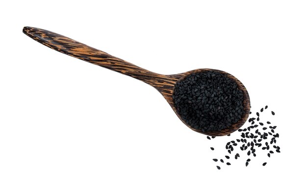 Sesame seeds in a wooden spoon