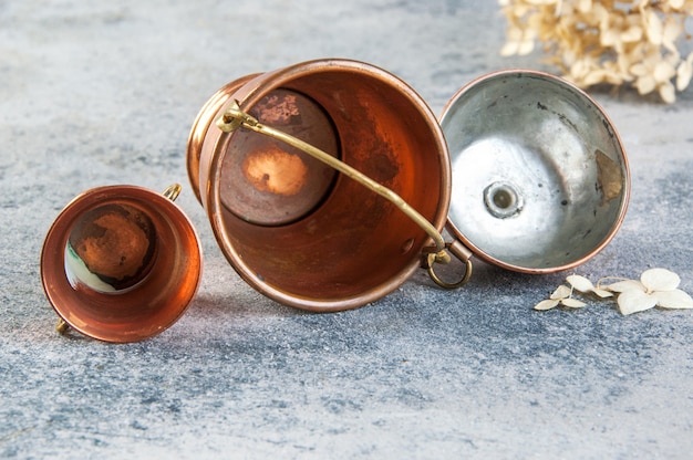 Set of 3 copper miniatures on concrete background