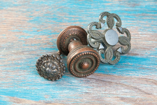 Set of 3 vintagel metal drawer pull knobs, furniture dresser handle on wooden background