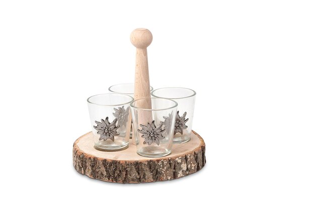 A set of 3 wooden shot glasses with a wooden base.