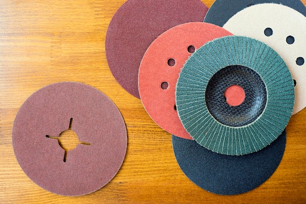 Set of abrasive materials on wooden background topl view