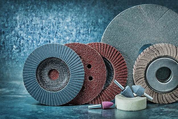 Set of abrasive tools on metalic background