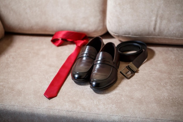 A set of accessories for the groom mens shoes and tie