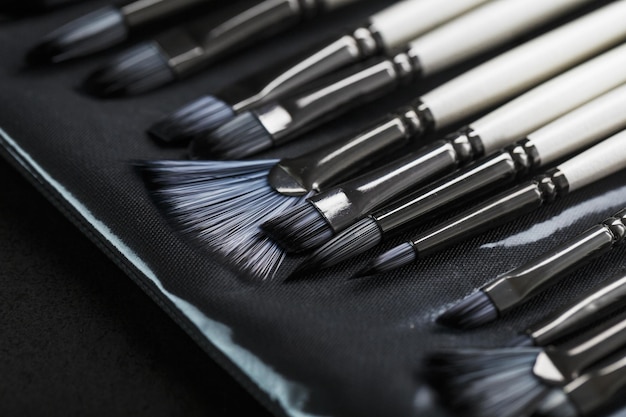 A set of art brushes for drawing on a black background