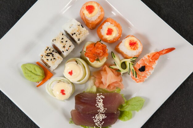 Set of assorted sushi served in a white plate
