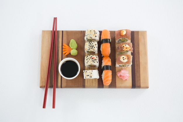 Set of assorted sushi served on wooden tray