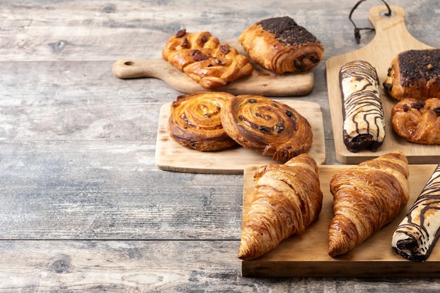 Set of bakery pastries on wooden table