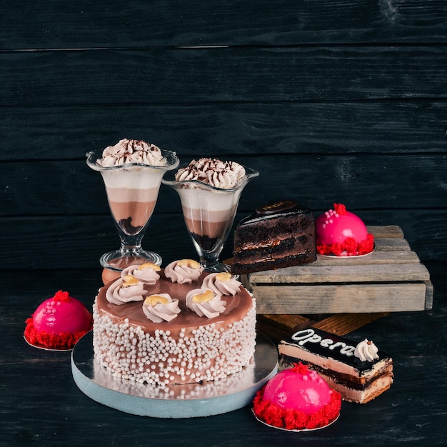 A set of baking cakes and desserts On a wooden background Top view Copy space