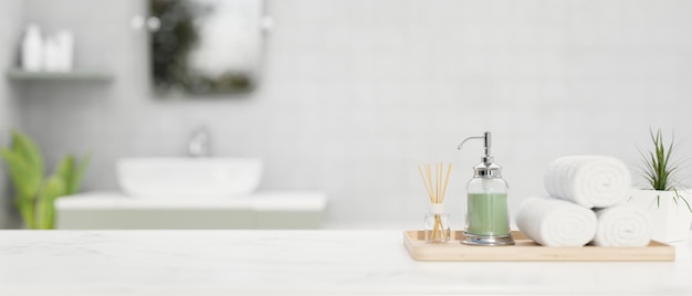 A set of bathroom accessories and copy space on white bathroom tabletop over blurred bright bathroom