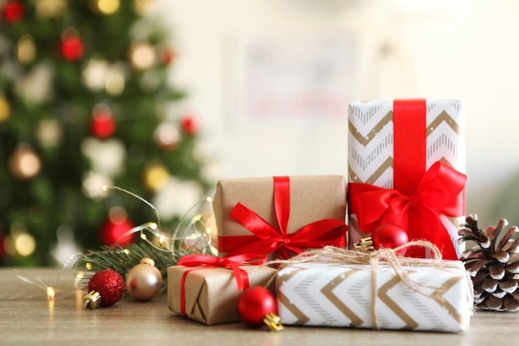 Photo set of beautifully wrapped gift boxes and christmas decor