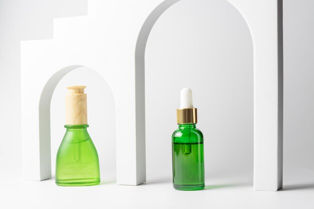 Set of beauty cosmetic products in green glass Natural beauty oil for skin care with peptides