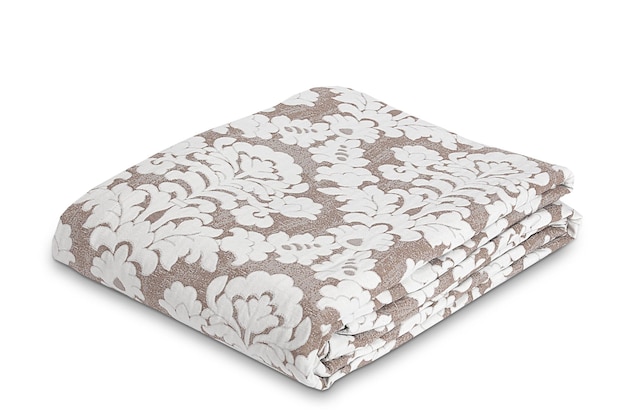 A set of beige floral bedding with white floral pattern