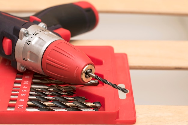 A set of bits and screwdriver in the red box closeup