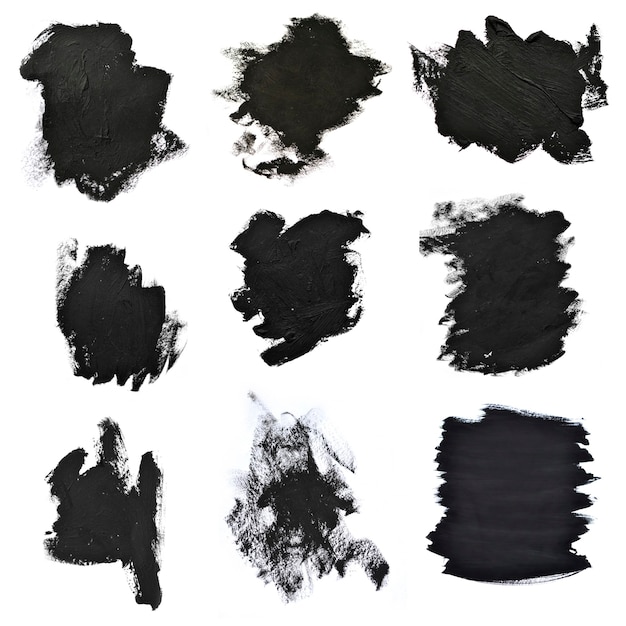 Set black brush strokes on white paper