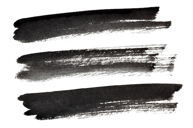 Set of black ink brush strokes isolated on the white background