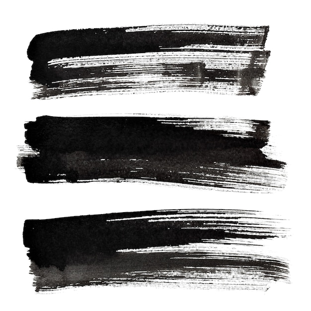 Set of black ink brush strokes isolated on the white background