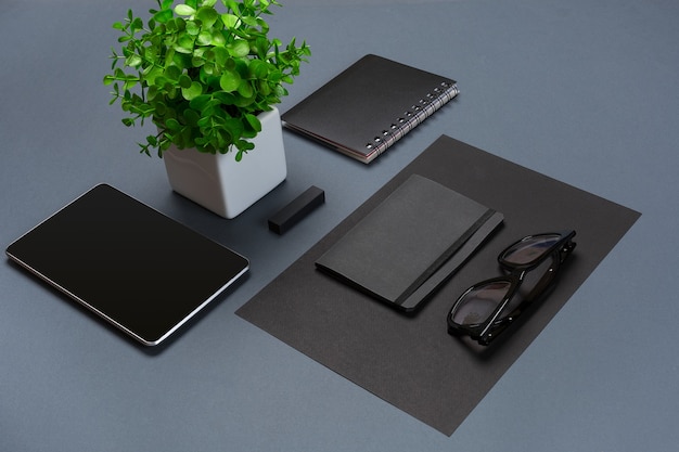 Set of black office stationery on a gray background flat lay