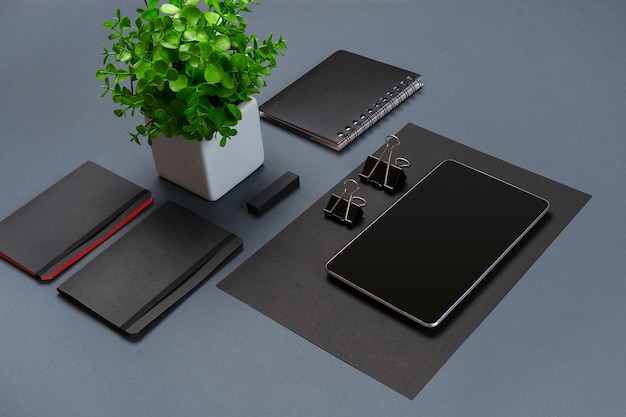 Set of black office stationery on a gray background flat lay